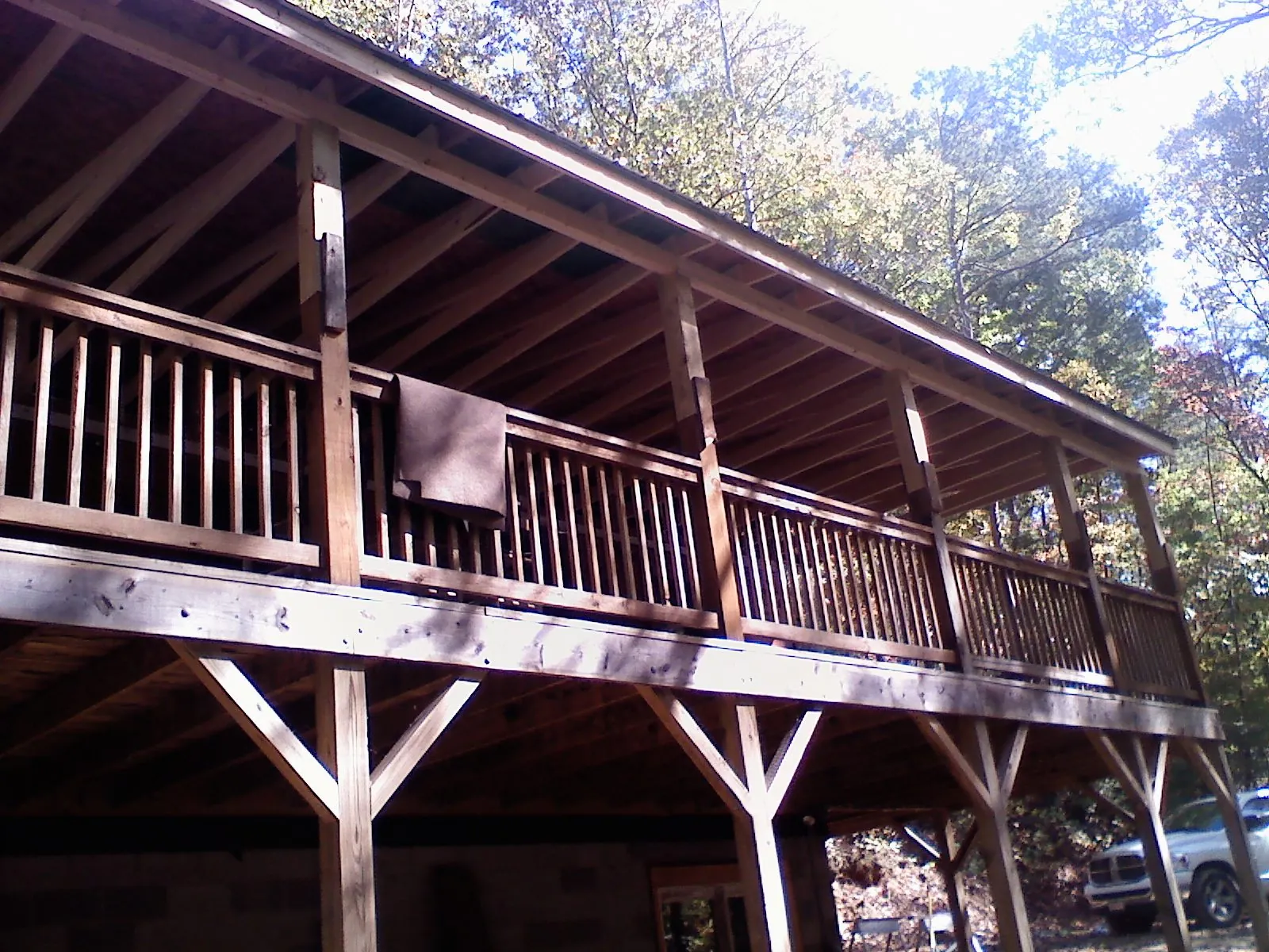 Timber framing under a new elevated porch and deck — Roof Leak Repair in Pine Lake by Roofing Brothers